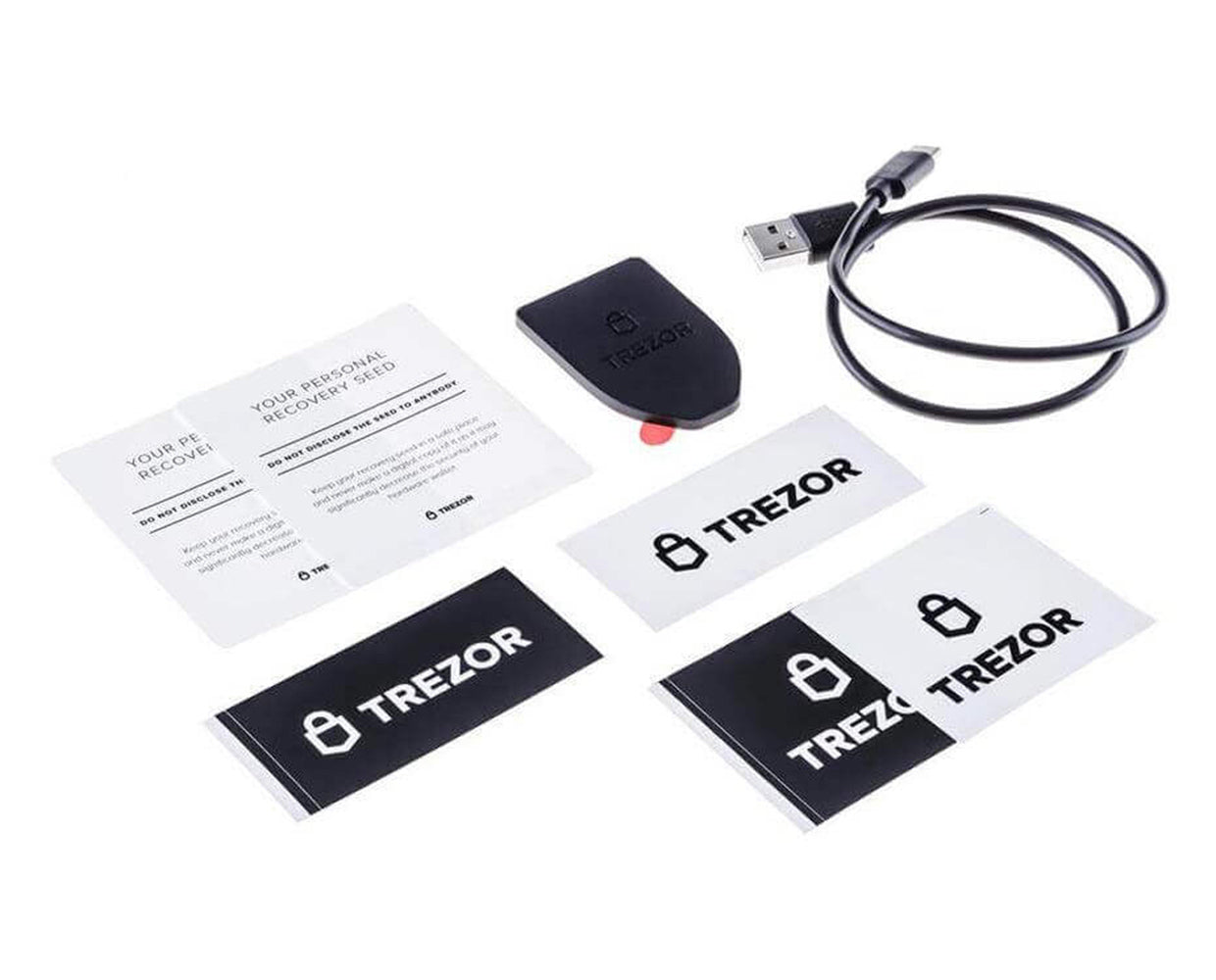 Trezor Model T hardware wallet with cable, wallet backup cards, and stickers